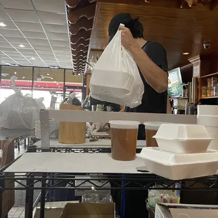 a man holding a bag of food