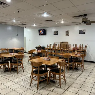 a restaurant with tables and chairs