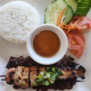 Jasmine rice,  veggies, and 3 skewers of grilled pork, chicken, and beef. Sooooo yummy!