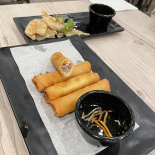 Pan fried dumpling (background)
 Minced Pork Eggroll 
 (foreground)