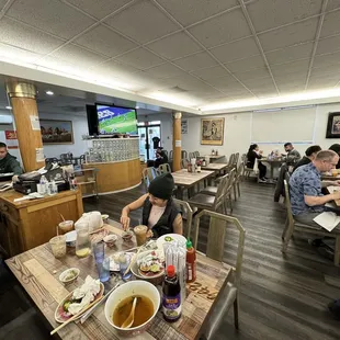 a group of people eating in a restaurant