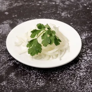 Thinly sliced onions doused in vinegar 
Hành Dấm