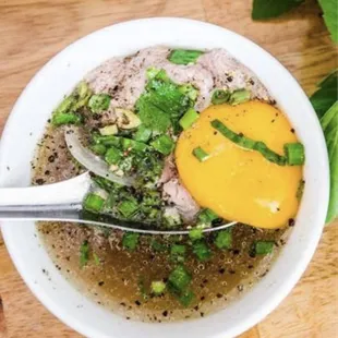 Bowl of cow blood cooked in broth add egg
Chén Tiếc Bò