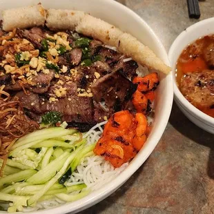 Weekend special menu item. Very tasty and large noodle bowl of grilled pork, shrimp, egg rolls, veggies and a special dipping sauce.