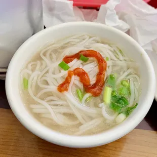 a bowl of soup with noodles and vegetables