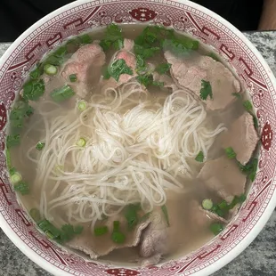 Rare beef pho with no white onions