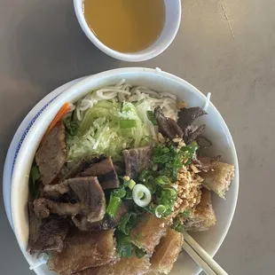 Bún thịt nướng cha giờ (grilled pork, egg roll, vermicelli noodle bowl with side of fish sauce)