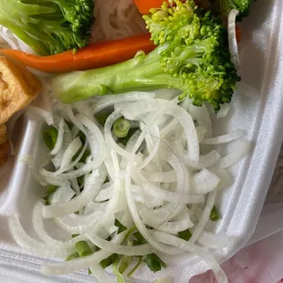 Vegetables and Tofu Soup with a long black hair