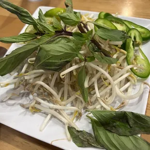 a plate of noodles and vegetables