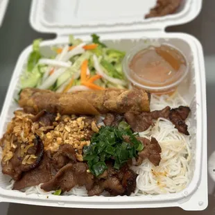 Bun bowl with spring rolls and pork