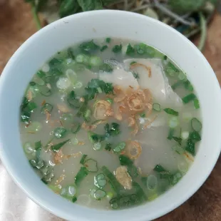 a bowl of soup with meat and vegetables