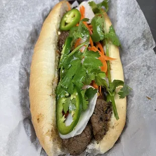 Now pho 99 &amp; grill serving Vietnamese sandwich And Bo Ne