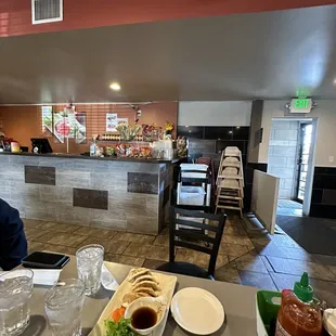 a man sitting at a table in a restaurant