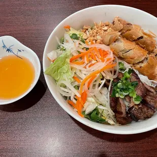 Bun with grilled pork and egg rolls