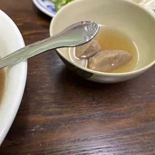 a bowl of soup with a spoon in it