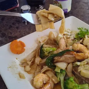 Flat noodles this was super good !!! Beef chicken and shrimp recommend.