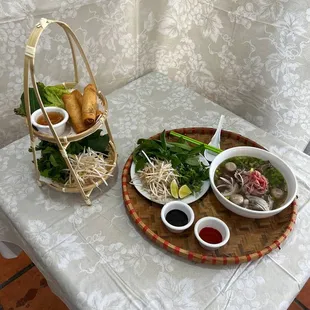 two bowls of soup and a basket of vegetables
