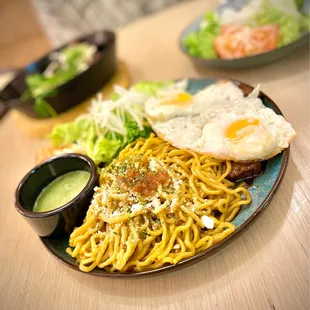 Shaken Beef + Garlic Noodles: Sautéed beef and garlic noodles.  Add eggs $2