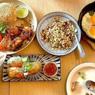 Garlic Butter Prawn with Fried Rice, Bò Né (beef skillet) with Bread for dipping, House Special Calamari, Lobster Rolls