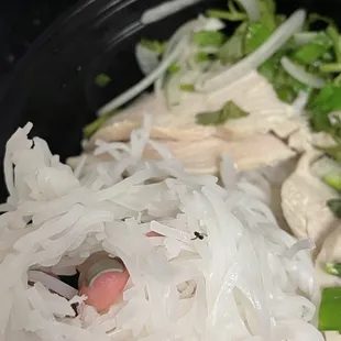 a bowl of noodles and chicken