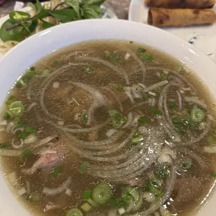 Filet mignon pho with egg rolls