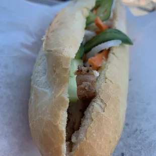 a sandwich with meat and vegetables