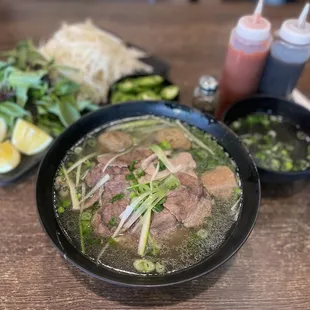 a bowl of soup with meat and vegetables