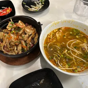 On the right is the chef's special - spicy noodles and I'm the left is the combination sizzling clay pot rice bowl.