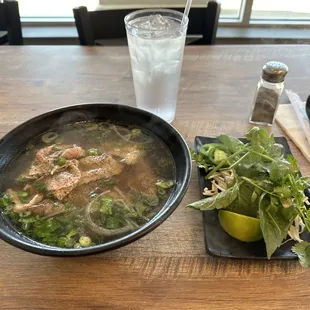 a bowl of soup and a glass of water