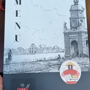 a person holding a menu
