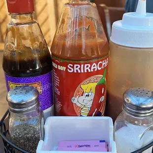 a variety of condiments on a table