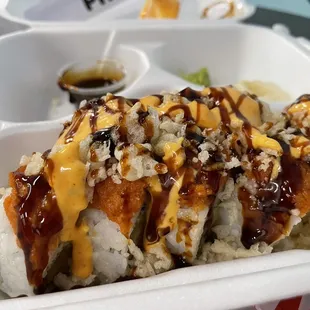 23. Crunch Dragon Roll after sauces are added. Super yummy! Be careful with the yellow sauce, it&apos;s fire