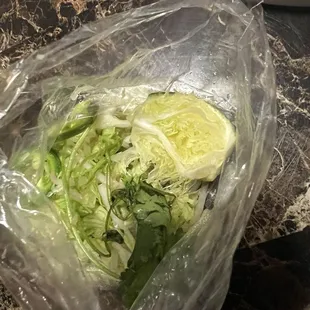 Left over veggies from someone&apos;s used plate. DISGUSTING!