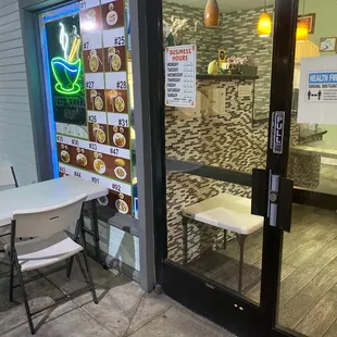 a table and chairs outside a restaurant