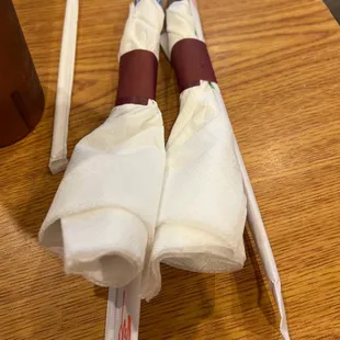 two folded napkins on a table