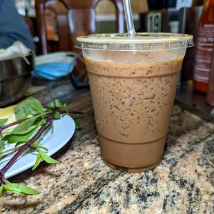 a smoothie in a plastic cup