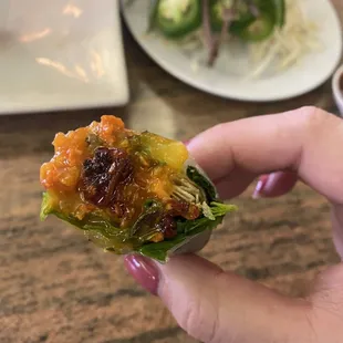 Nem Nuong roll, D, with sauce and some lemon grass pepper