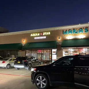 cars parked in front of the restaurant