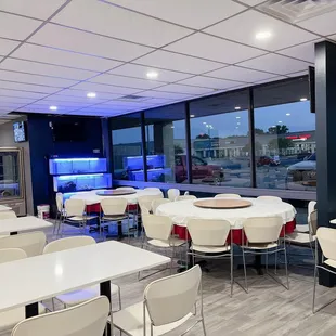 a view of a restaurant with tables and chairs