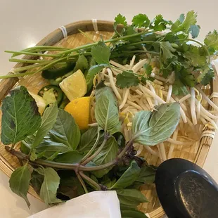 a bowl of noodles and greens