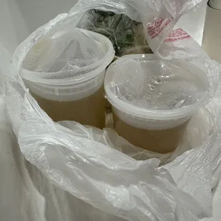 two cups of coffee in a plastic bag