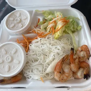 shrimp and noodles in a styrofoam container