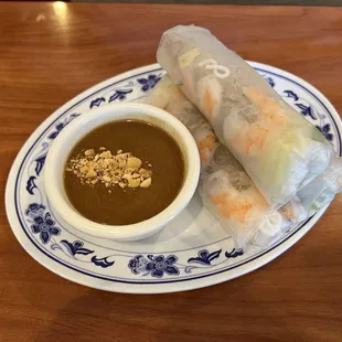 Shrimp spring roll with peanut dipping sauce.