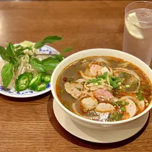 a bowl of soup and a glass of water