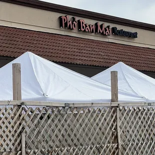 Front of restaurant. There are canopies, but currently indoor dining only.