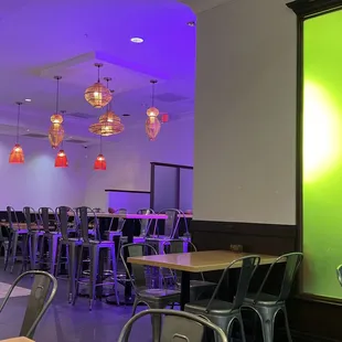 tables and chairs in a brightly lit room