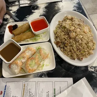 Fried egg rolls (2- $4), Spring rolls (2-$4), and combination fried rice (shrimp, chicken, and pork $10.95)