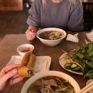 Egg rolls, pho tai with brisket and pho ga.