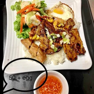 Grilled pork chop with shrimp and egg rolls with egg