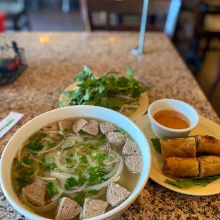 P9. Meatballs Noodle Soup and half order of A3. Egg Rolls